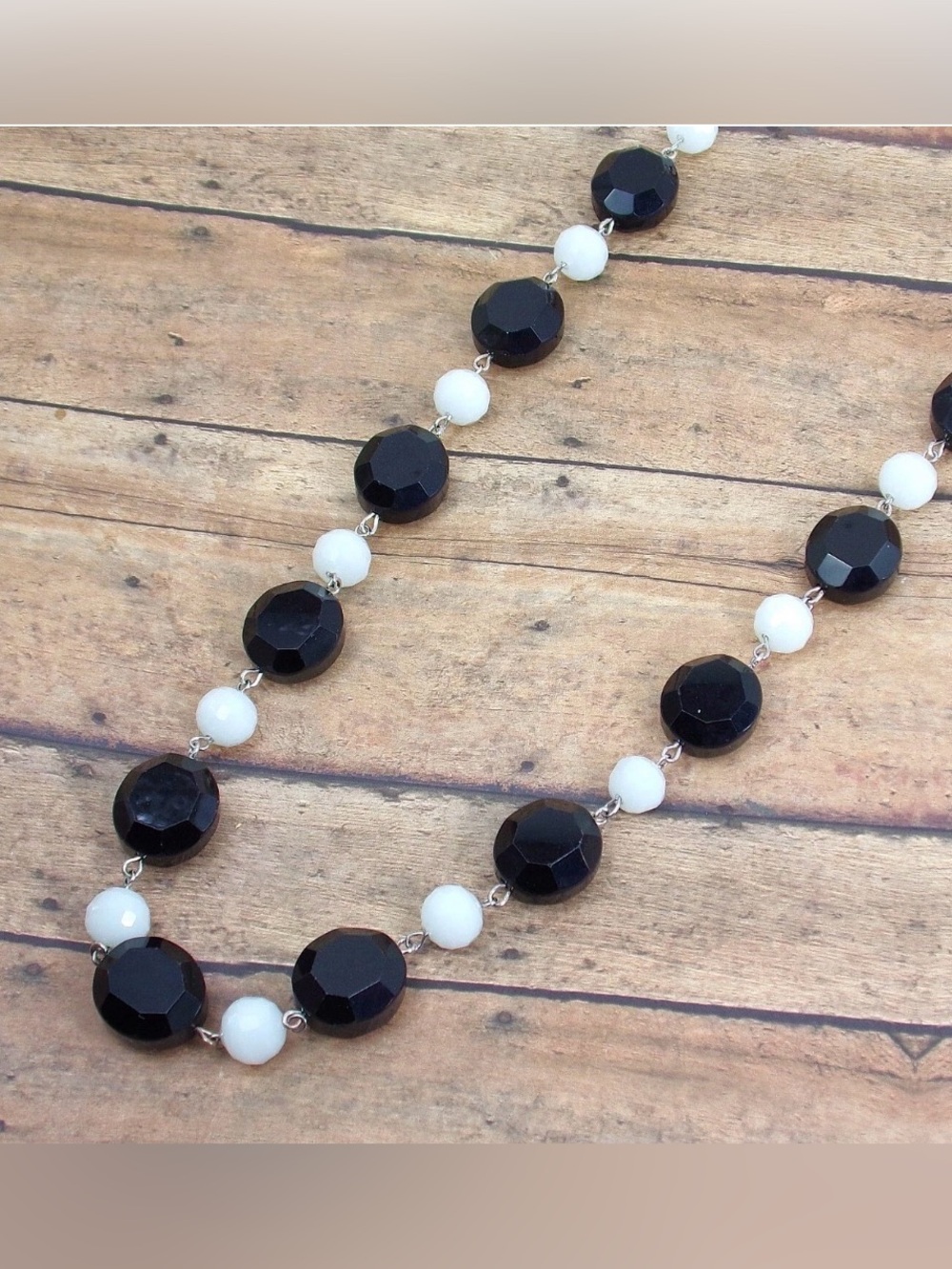 Black and white glass bead necklace with large black oval beads New